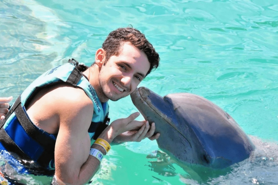 men with a dolphin